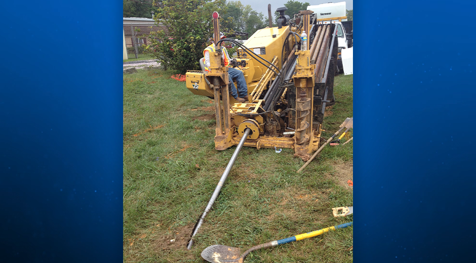 Workers installing PVC conduit