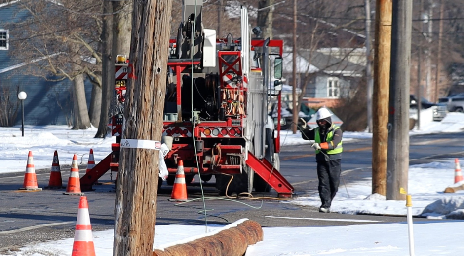 Line Worker replacing a pole