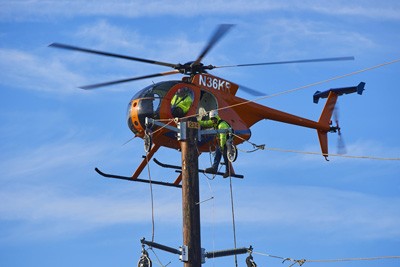 Helicopter aiding in transmission work